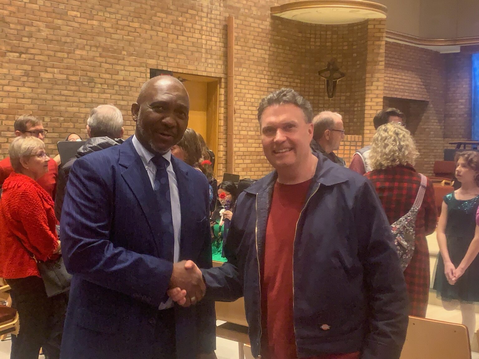 Founder shaking hands with community member